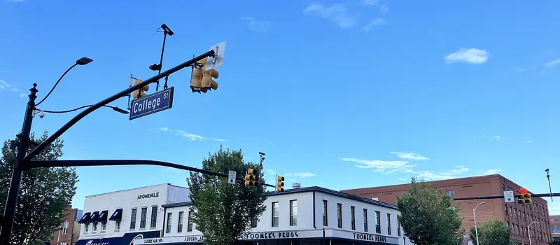 Toomer's Corner with trees and storefronts in Auburn, Alabama