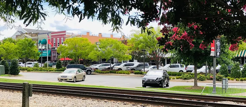 Railroad tracks and storefronts in downtown Opelika, Alabama
